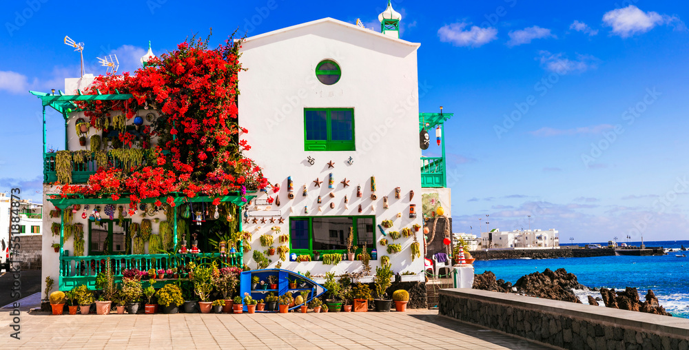 Lanzarote scenic places. Charming  Punta Mujeres traditional fishing village with floral streets and white houses. popular  for natural swim pools. Canary islands travel