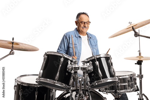 Casual mature man practicing playing drums