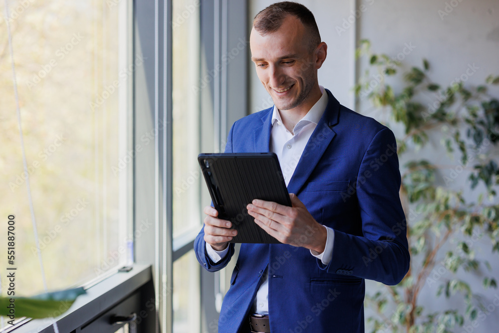 Portrait of a businessman holding a tablet Portrait of a businessman holding a tablet