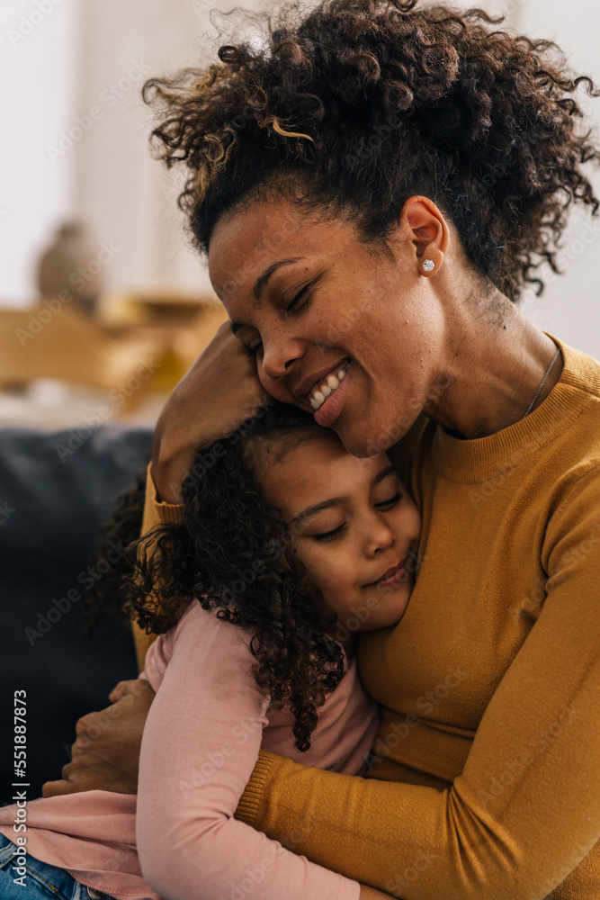 Obraz premium Blessed mom hugs her dear daughter