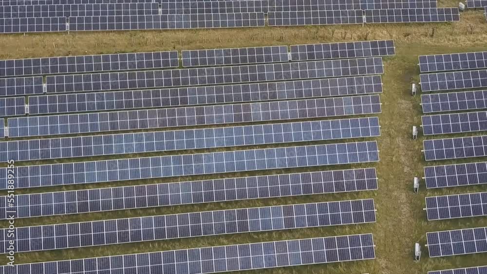 Aerial view above sunlight collectors at a photovoltaic plant Aerial view above sunlight collectors at a photovoltaic plant
