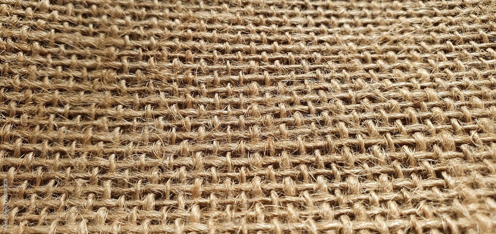 Brown natural fabric. Burlap fabric close up. Texture of brown fabric. burlap texture. Network texture. Brown natural fabric. Burlap fabric close up. Texture of brown fabric. burlap texture. Network texture.