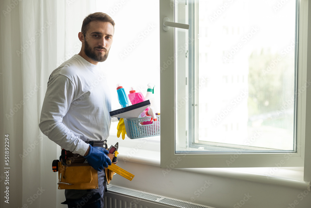 Professional cleaning, man washes window Professional cleaning, man washes window