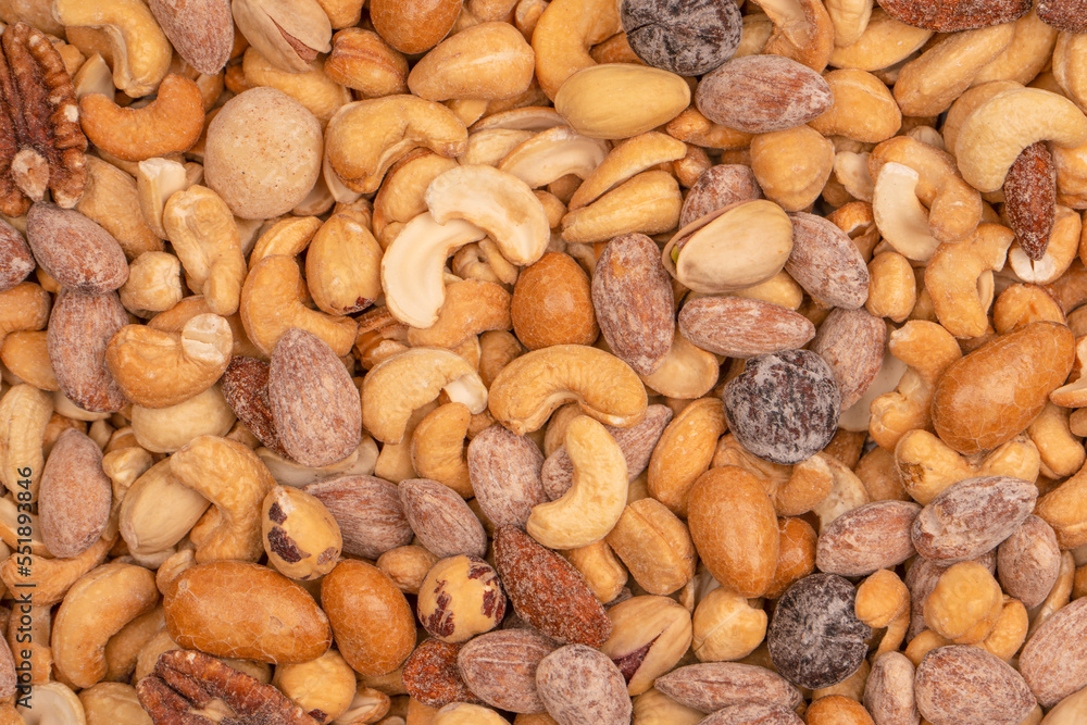 A group of almonds, pistachios, walnuts, macadamia, cashews. A group of almonds, pistachios, walnuts, macadamia, cashews.