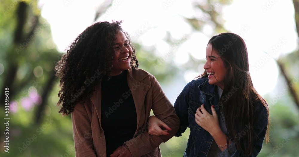 Fototapeta premium Friend sharing gossip secret whispering to women ear