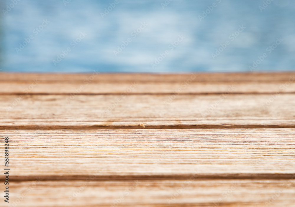 empty wooden table and sea in background empty wooden table and sea in background
