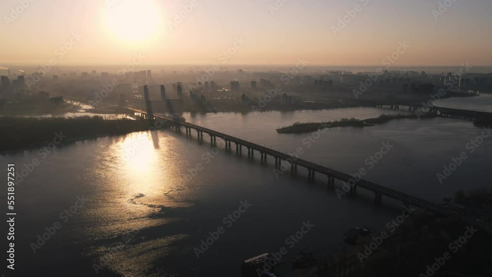 Kyiv, Ukraine - April, 2021: Morning aerial view on foggy city with traffic and bridge 4k Kyiv, Ukraine - April, 2021: Morning aerial view on foggy city with traffic and bridge 4k