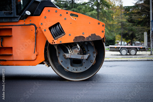 Roadwork and asphalt paving machine for road construction.