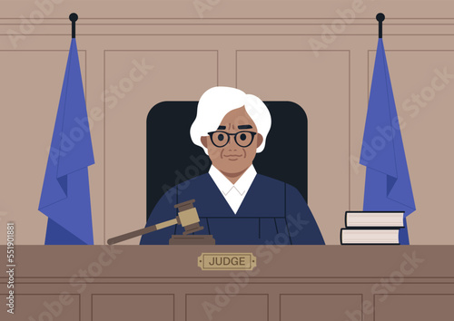 A portrait of a female Caucasian judge wearing a robe in a courtroom, justice and law