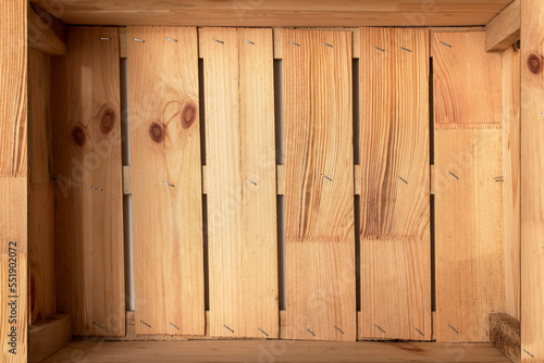 Opened wooden box. Wooden background