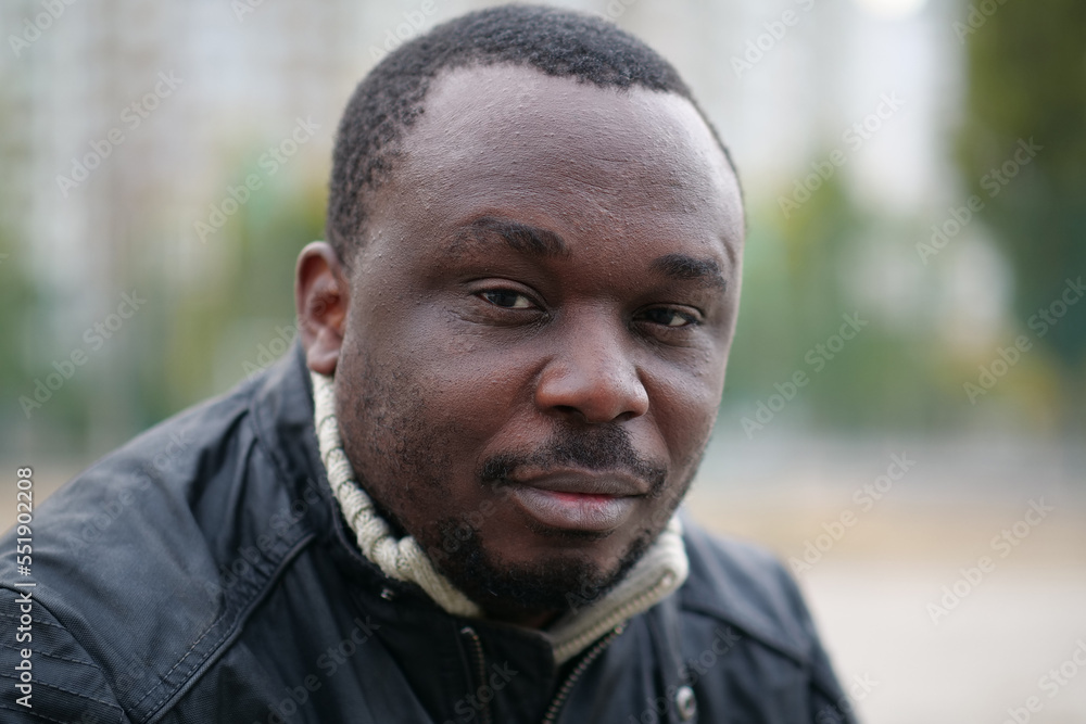 Fototapeta premium African american man from Nigeria looks at the camera