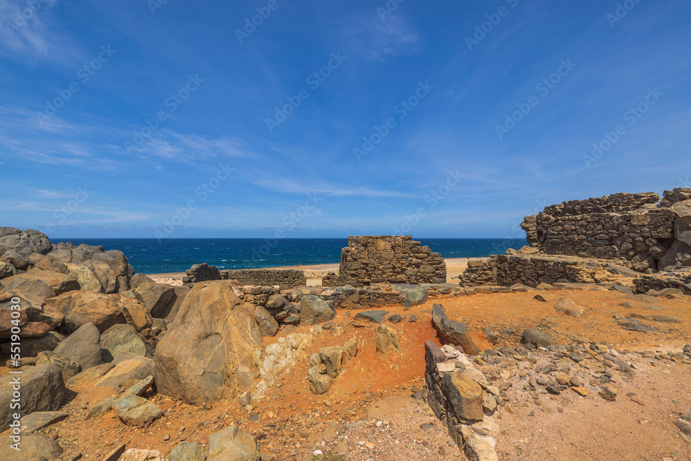 Beautiful historical view of ruins of Bushiribana gold smelter on desert coast of Caribbean sea of Aruba island.