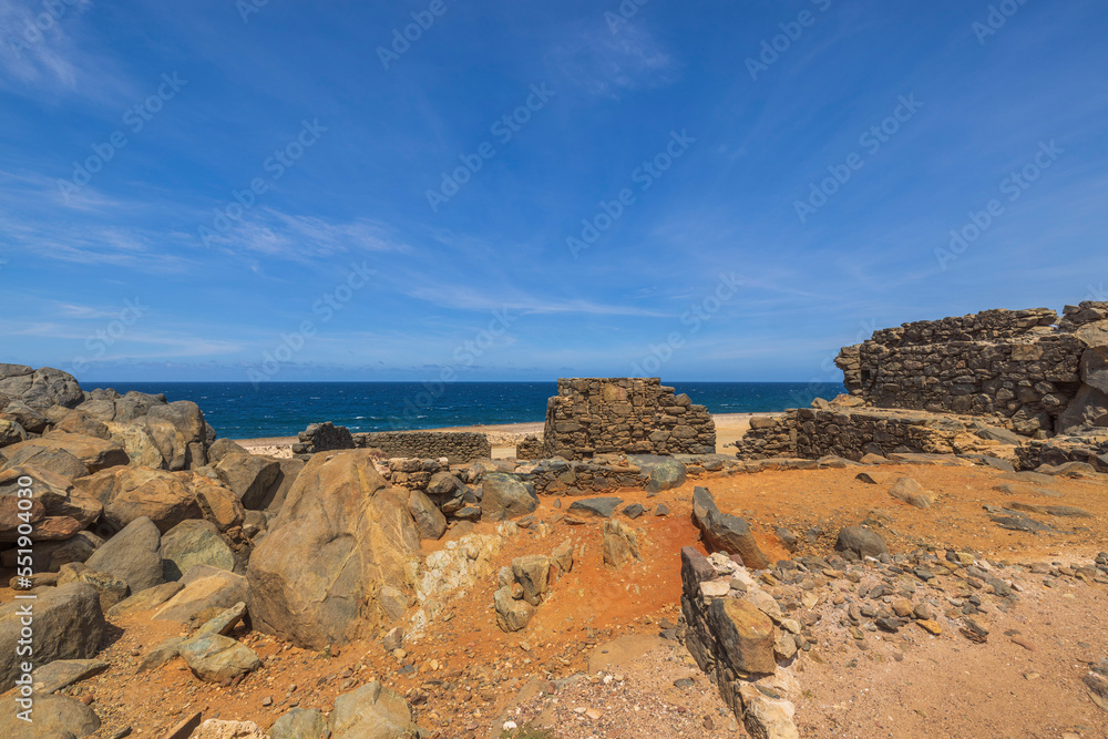 Beautiful historical view of ruins of Bushiribana gold smelter on desert coast of Caribbean sea of Aruba island. Beautiful historical view of ruins of Bushiribana gold smelter on desert coast of Caribbean sea of Aruba island.