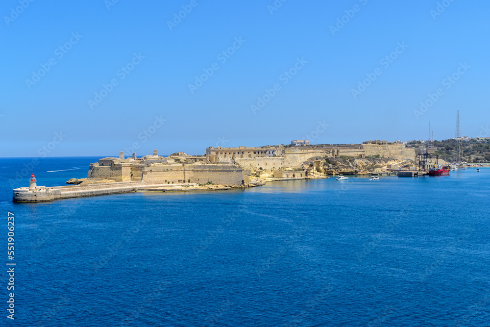 The entrance to the Grand Harbour in Malta protected by Fort Ricasoli. In front of the fort is the Ricasoli Breakwater and its lighthouse.