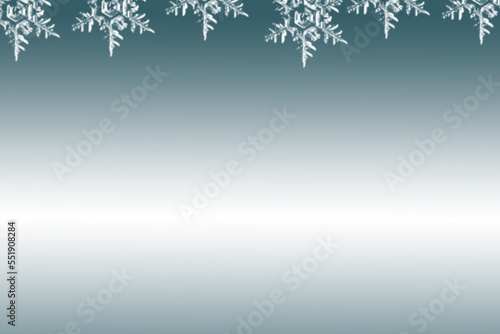 Niebieskie, zimowe tło z białymi płatkami śniegu. 