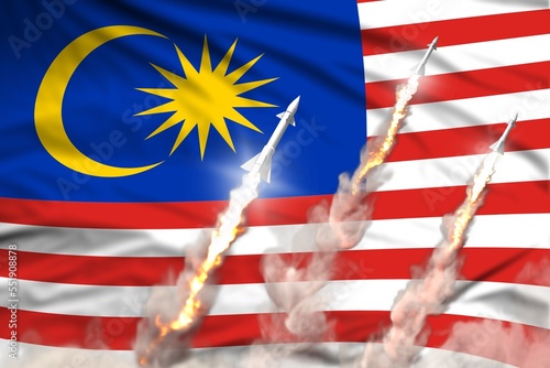 Malaysia supersonic missile launch - modern strategic nuclear rocket weapons concept on flag fabric background, military industrial 3D illustration with flag photo