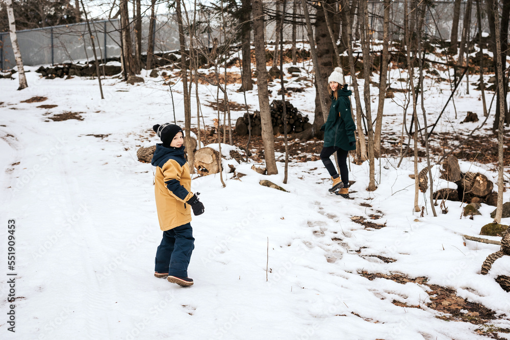 winter boy activity with family outdoor fun