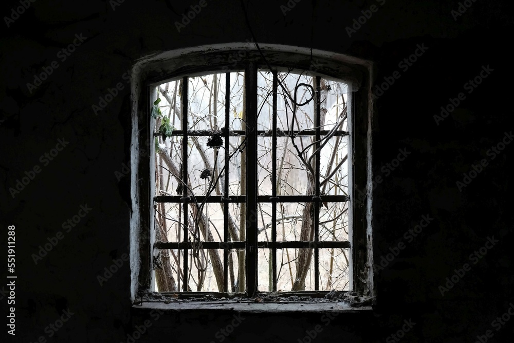 Window without glass in dark abandoned building. Window without glass in dark abandoned building.
