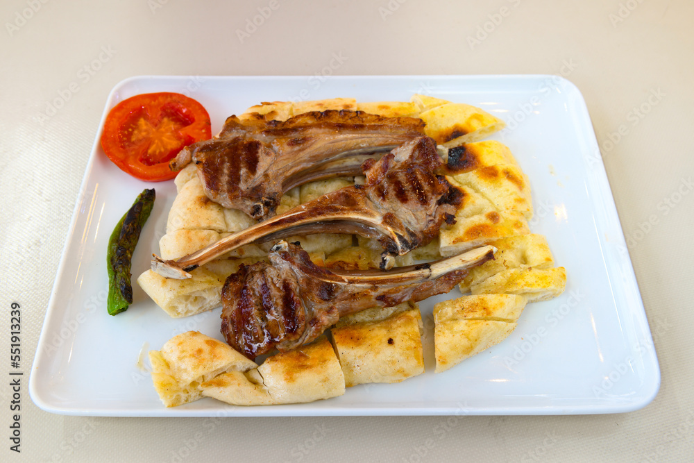 Beef steak grill with rice pilaf, fried potatoes, grilled pepper and tomatoes.Mix Platter with Beef rips, Cutlets, Potatoes and Sauces. Beef steak grill with rice pilaf, fried potatoes, grilled pepper and tomatoes.Mix Platter with Beef rips, Cutlets, Potatoes and Sauces.