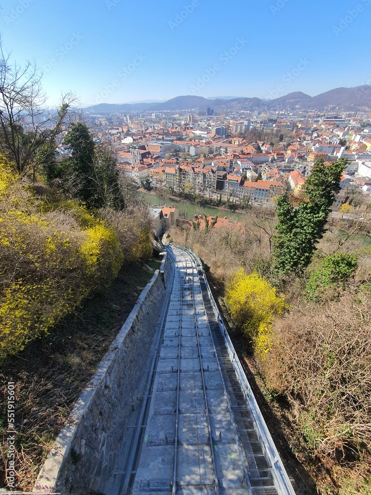 View to Graz and the steep railway onto famous and distinctive Schlossberg in the center of the town. Styria, Austria View to Graz and the steep railway onto famous and distinctive Schlossberg in the center of the town. Styria, Austria