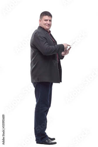 side view. Mature business man with a digital tablet.