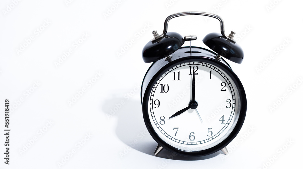 Old style alarm clock isolated on white