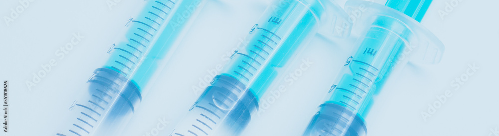 Medical syringe on a white background. A syringe for injection. The concept of health and beauty Medical syringe on a white background. A syringe for injection. The concept of health and beauty