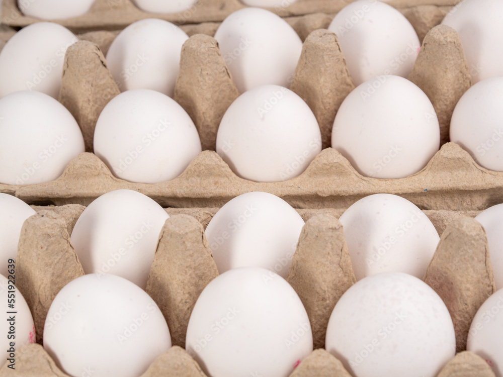 Chicken eggs in a package. White eggs in a box. Chicken eggs in a package. White eggs in a box.