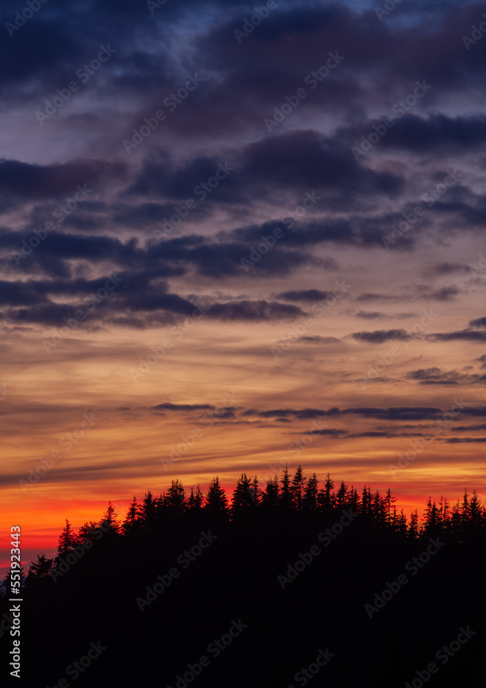 sunset over the hills of the mountains. the beautiful evening landscape