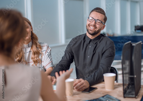 business team discussing business issues over a Cup of coffee