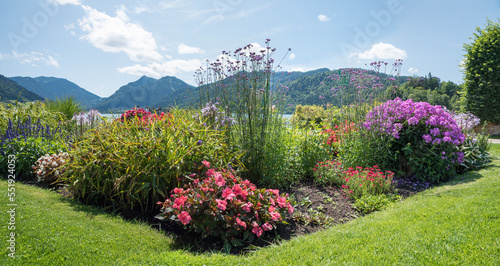 Photography beautiful spa garden Schliersee with colorful flowerbed