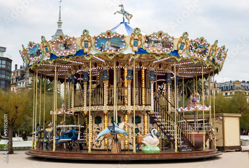Carousel merry go round in Donostia San Sebastian during Christmas winter holidays 