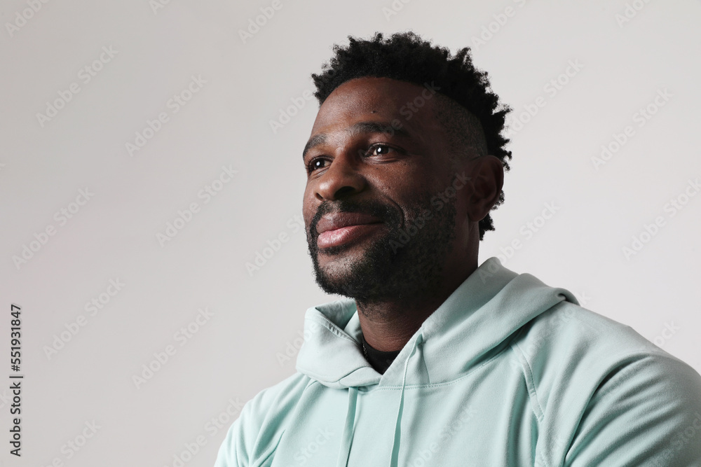 Obraz premium Overjoyed dark skinned man wears casual outfit. Good emotions concept. Mock-up.