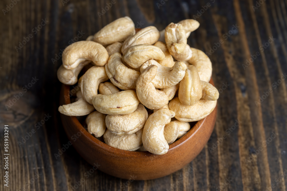 Hard roasted and peeled cashew nuts on the table Hard roasted and peeled cashew nuts on the table