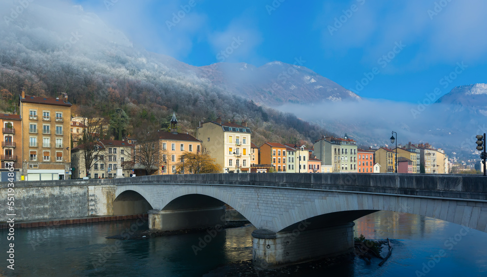 View on hills of Grenoble with colorful houses in France outdoors.