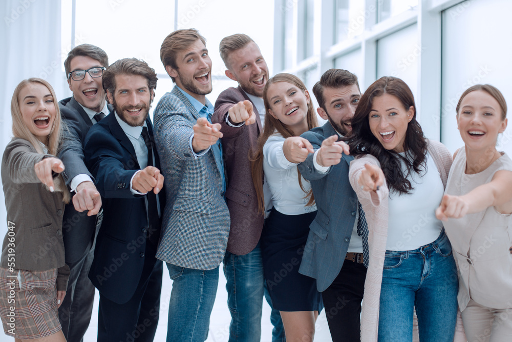 group of successful young people pointing at you