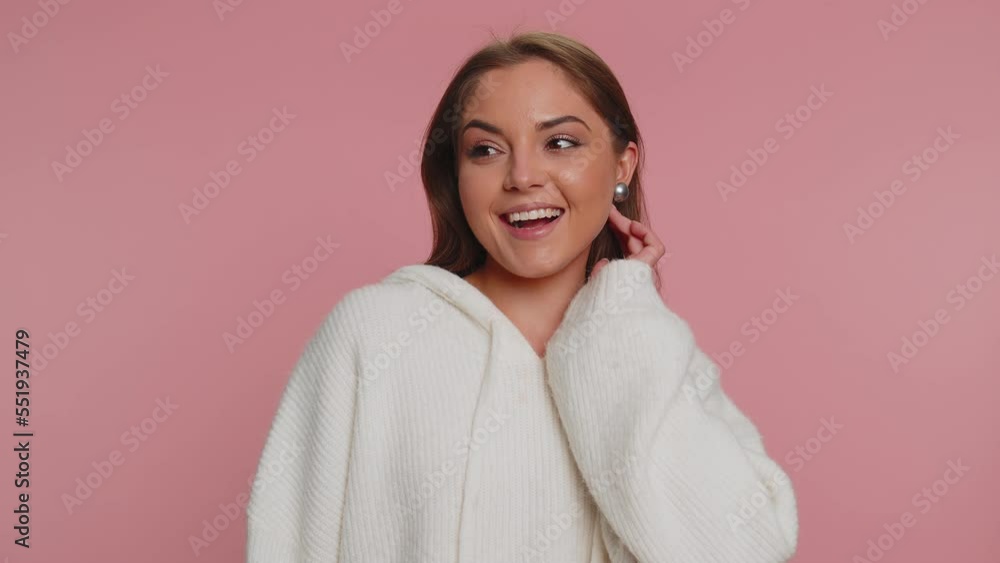 Portrait of happy calm young woman in white sweater. Pretty girl smiling friendly, glad expression looking away dreaming resting, relaxation feel satisfied concept good news. Pink studio background Portrait of happy calm young woman in white sweater. Pretty girl smiling friendly, glad expression looking away dreaming resting, relaxation feel satisfied concept good news. Pink studio background