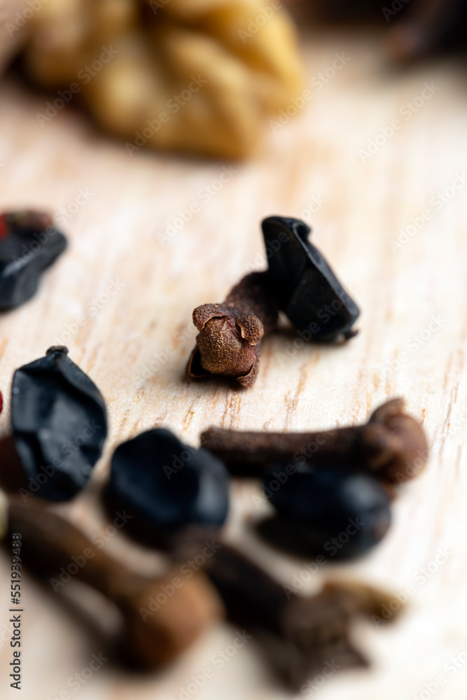 Dried clove spices on the board Dried clove spices on the board