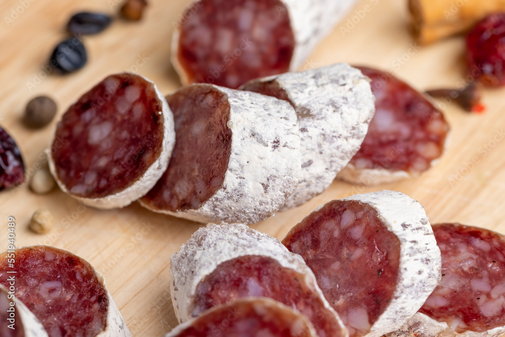 Chunks of sliced sausage with white mold Chunks of sliced sausage with white mold