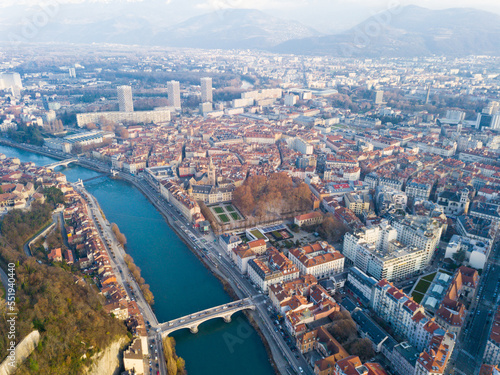Aerial view Grenoble of city center with embankment of Isere river, France
