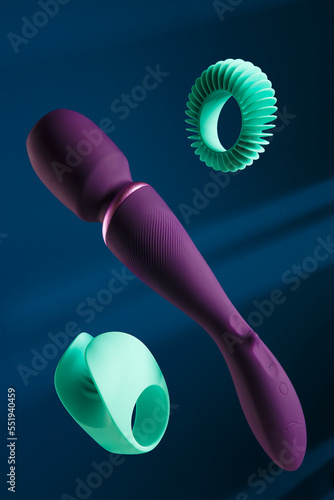Purple Silicone Sex Clitoris Massager for Women. Sex toys on a dark background. Sex Gadget and Masturbation Device Sex Shop Concept, Vibrator Toy for Man and Woman