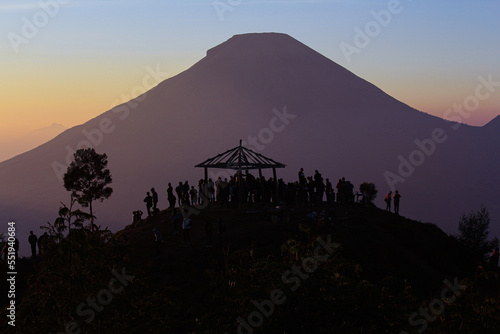 Enjoying the sunrise in the camping area at the top of Sikunir Hill, Wonosobo, Central Java