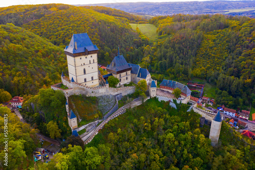Aerial view of medieval Karlstejn castle in autumn park, Czech Republic