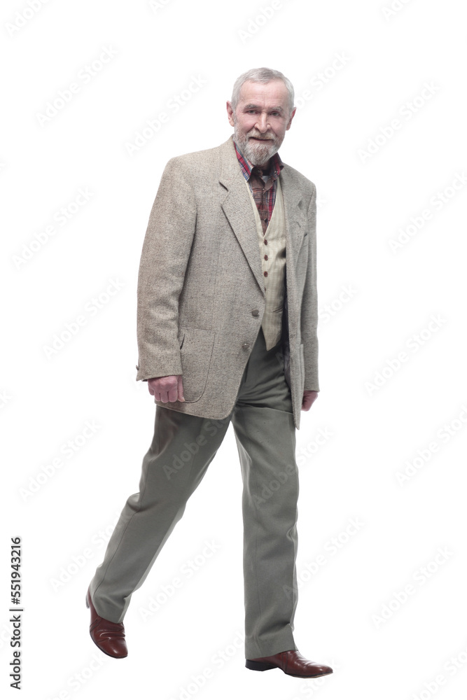 in full growth. confident old man striding forward . in full growth. confident old man striding forward .