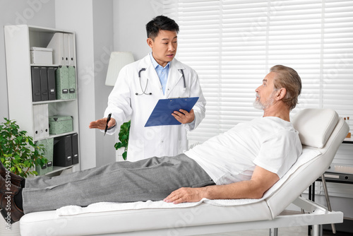Senior patient having appointment with doctor in clinic