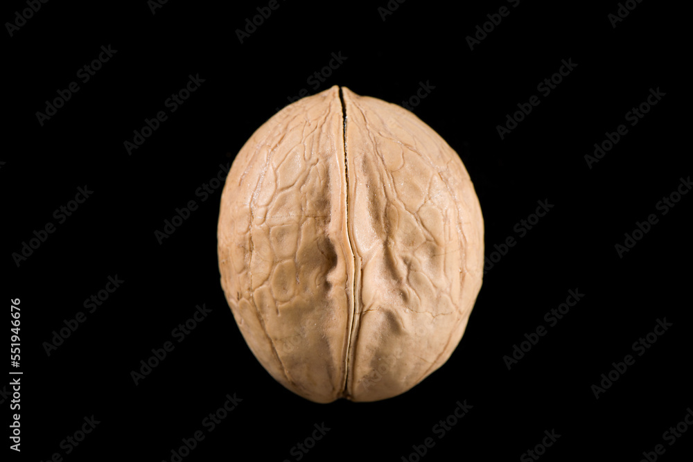 Fototapeta premium Walnut Nuts isolated on black background.