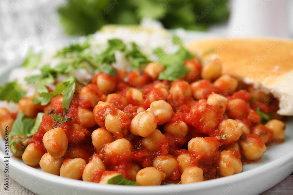 Plate with delicious chickpea curry on table, closeup Plate with delicious chickpea curry on table, closeup