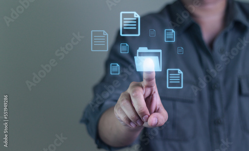 Wallpaper Mural Male businessman extending hand to document file information online in paperless office electronic document management E-sign business contract Torontodigital.ca