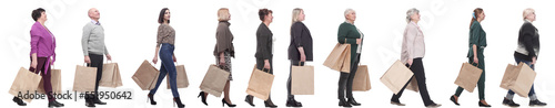 a group of people are running paper shopping bags © ASDF