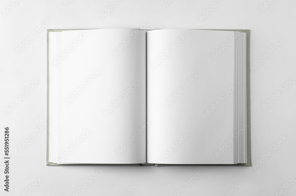 Open book on white background, top view Open book on white background, top view